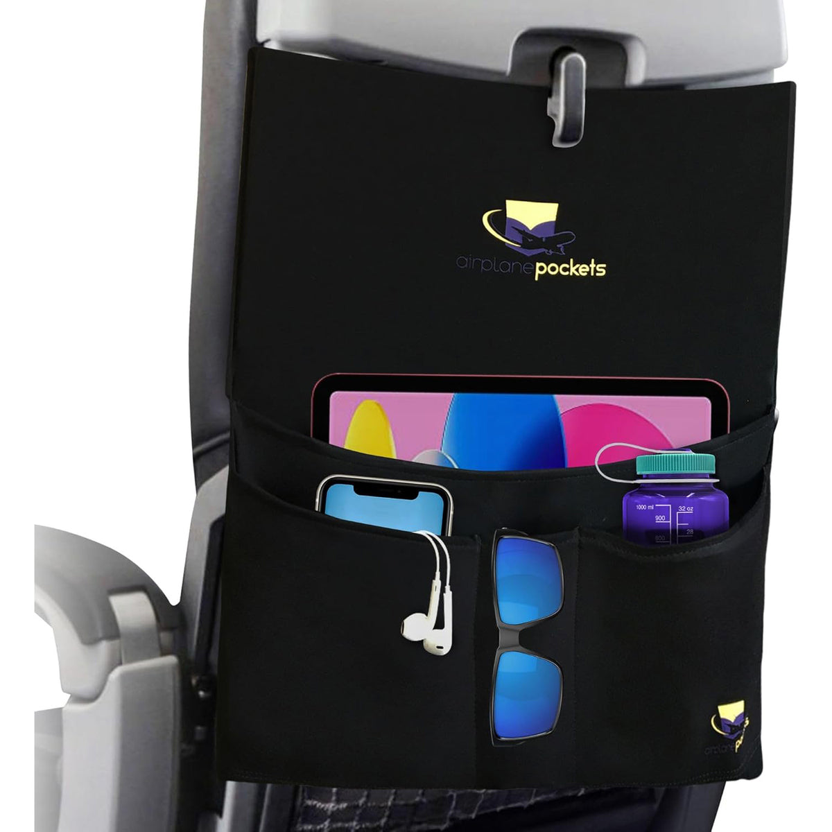 Airplane tray table cover with built-in pockets for organization and convenience during flights