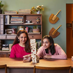 Colorful family board games collection, showcasing the wooden tumbling tower game that brings everyone together for friendly competition