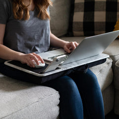 Adjustable laptop desk for bed, couch, or sofa, offering a sturdy and ergonomic workspace solution